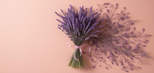  Lavender bouquet with white ribbon on peach background.
