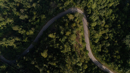 Fototapeta premium drone aerial view of signal towers and roads in valleys and forests
