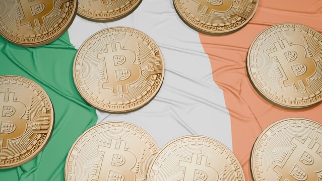 Several bitcoins are laid out on the flag of Irish - Powered by Adobe