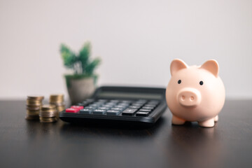 Finance bank tax expense accounting budget money businessman hand use calculator Financial calculate accountant close up calculator with graph chart write office desk Business expense analysis saving