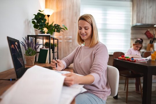 Working from home in a cozy, modern living space with family nearby