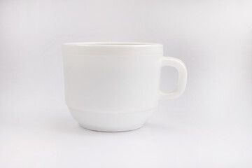 White cup with tea on a white background.