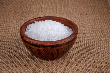 Clay cup with salt. table salt.