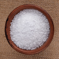 Clay cup with salt. table salt.