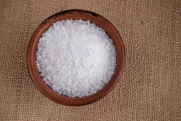Clay cup with salt. table salt.