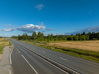 Aerial view of Tallinn-Tartu highway on a sunny summer evening. Tartu county, Estonia. 