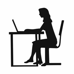 A woman is sitting at a desk with a laptop. She is wearing a black shirt and black pants