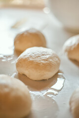 Preparation homemade pizza on kitchen table.