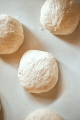 Preparation homemade pizza on kitchen table.