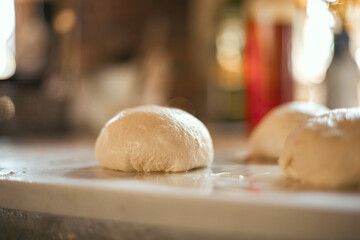 Preparation homemade pizza on kitchen table.