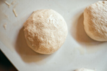 Preparation homemade pizza on kitchen table.