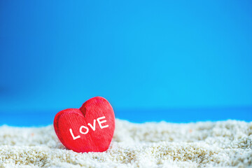 Fototapeta premium red Heart shape on white sand beach ,Image for love valentine day or summer vacation concept