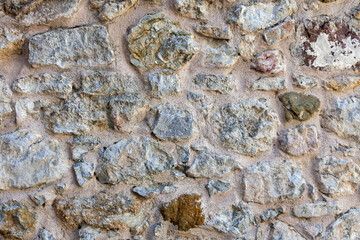 Stonewall. A stone wall made using concrete. Close-up background.