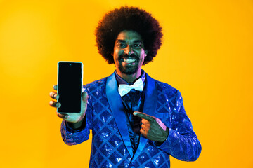 African man portrait in studio on colorful background - Cool black young male with stylish attire...