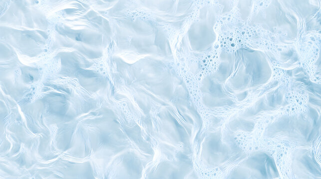 Water surface with movement creating small bubbles from top view on light blue background.