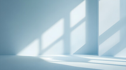 Fototapeta premium An empty, pale blue room with morning sunlight streaming down.