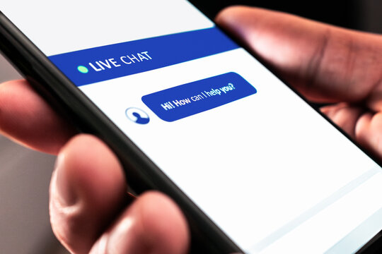 Live customer chat or chatbot service. Support bot for online help on website. Automated message in mobile phone. Assistant and communication app on cell screen. Digital care or feedback for business.