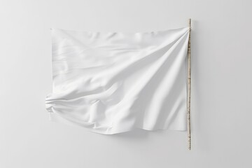A white flag draped on a wooden pole isolated on white background