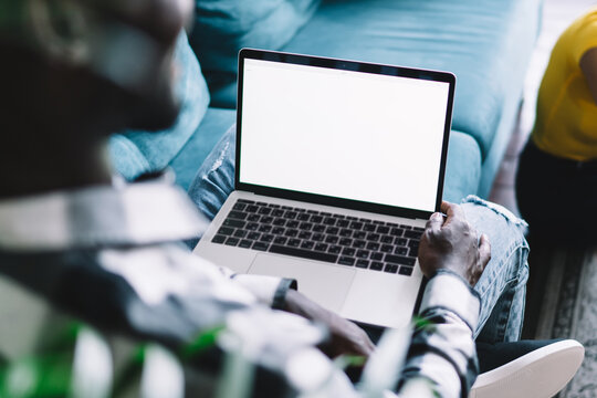 Multiethnic couple talking in modern living room