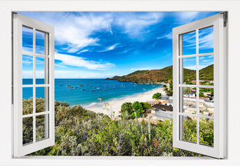 Window with a view of the ocean and mountains