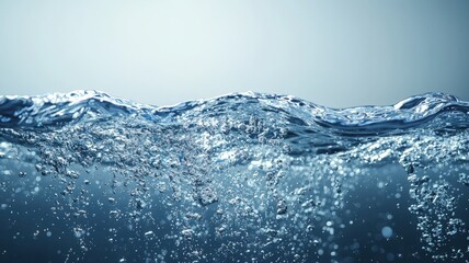 Crystal clear water surface creating large and small bubbles, enhanced by a beautiful bokeh effect, radiating freshness and purity background