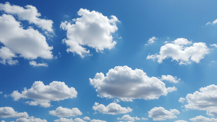 Obraz premium A serene blue sky featuring soft, white clouds scattered throughout