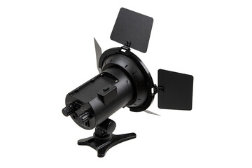 A professional studio light with barn doors, used for controlling light direction and intensity in photography and videography, mounted on an adjustable stand.