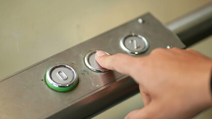 Hand pressing button. Close-up person hand presses elevator level one button