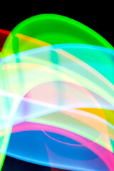 Neon Rainbow Light on Black Background Abstract Lines Swirls and Waves