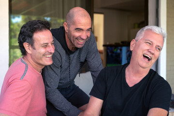 Group of happy senior men smiling, enjoying a day together.