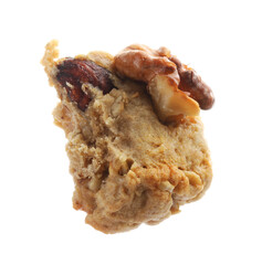 Piece of tasty cookie with nuts isolated on white