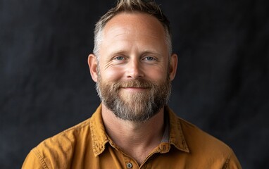 Obraz premium Portrait of a Smiling Middle-Aged Man with Beard