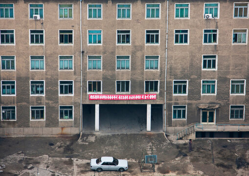 High angle view of buildings in the city center with a car parket at the entrnace, Pyongan Province, Pyongyang, North Korea