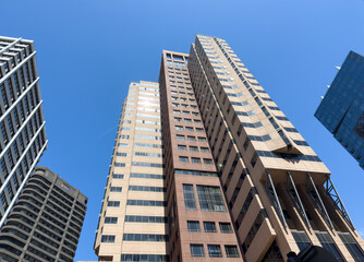 Cape town city skyscrapers against blue sky, high rise office buldings under view. South Africa