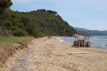 Cala civetta beach with wooden hut, Tuscany, Italy