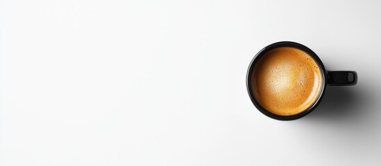 Black coffee cup on a white background with ample copy space for text and branding design. Minimalist design concept.