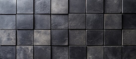 Naklejka premium Textured black cement concrete tile background with gray undertones offering ample space for creative text placement, ideal for modern design applications.
