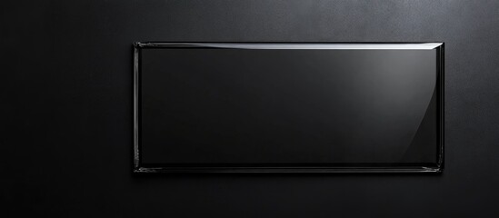 Elegant black glass plaque with shiny silver border contrasted against a dark textured background, featuring ample copyspace for personalized text.