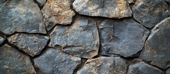 Obraz premium Black Grunge Stone Texture on Concrete Surface with Natural Rock Patterns and Empty Copyspace for Text in a Dimly Lit Background