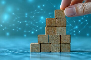 Close up Woman hand arranging wood block stacking as step stair on paper blue background