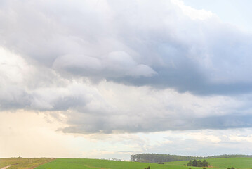 Obraz premium Rain clouds and cumulonimbus clouds over the pampa biome