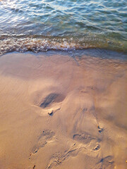 Background photo of waves on a sand beach