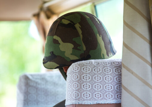 North Korean soldier wearing an helmet in a tourist bus on the Demilitarized Zone, North Hwanghae Province, Panmunjom, North Korea