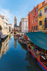 Picturesque Venetian Canal with Bell Tower and Market Boat