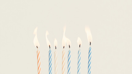 Birthday Candles Glow: Seven pastel-colored birthday candles with flickering flames create a festive and joyful scene, perfect for celebrations and greeting cards.
