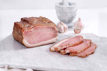 Meat homemade delicacies dry-cured on a light background