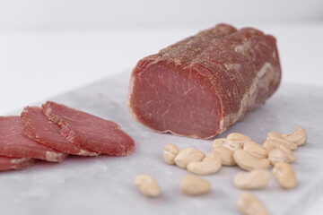 Meat homemade delicacies dry-cured on a light background