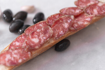 Meat homemade delicacies dry-cured on a light background