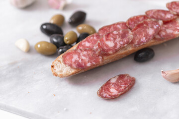 Meat homemade delicacies dry-cured on a light background