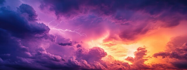 Obraz premium Dramatic sunset sky with vibrant purple and orange clouds illuminated by sunlight Copy Space